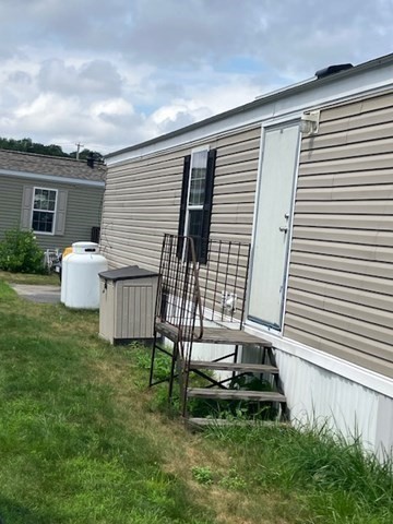 557 Southwest Cutoff, Unit 100 Worcester, MA 01607 - Photo 25 of 31 a view of backyard with a garden and entertaining space