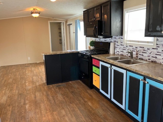 557 Southwest Cutoff, Unit 100 Worcester, MA 01607 - Photo 4 of 31 a kitchen with stainless steel appliances granite countertop a stove a sink and a microwave
