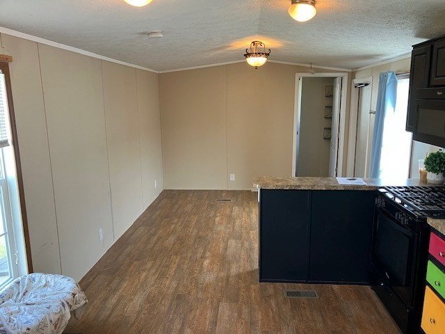 557 Southwest Cutoff, Unit 100 Worcester, MA 01607 - Photo 6 of 31 wooden floor in an empty room