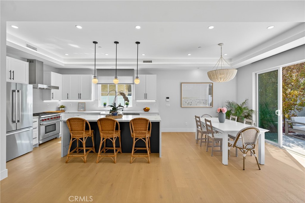 2216 Bataan Road, Unit A Redondo Beach, CA 90278 - Photo 11 of 60 a large kitchen with a table and chairs