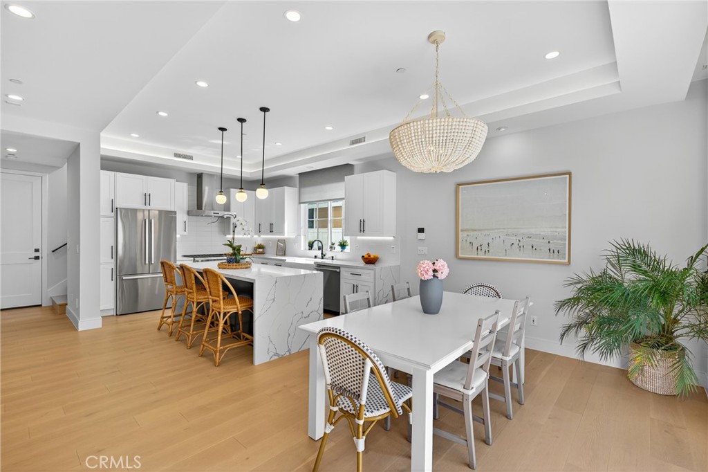 2216 Bataan Road, Unit A Redondo Beach, CA 90278 - Photo 17 of 60 a view of a dining room with furniture window and wooden floor