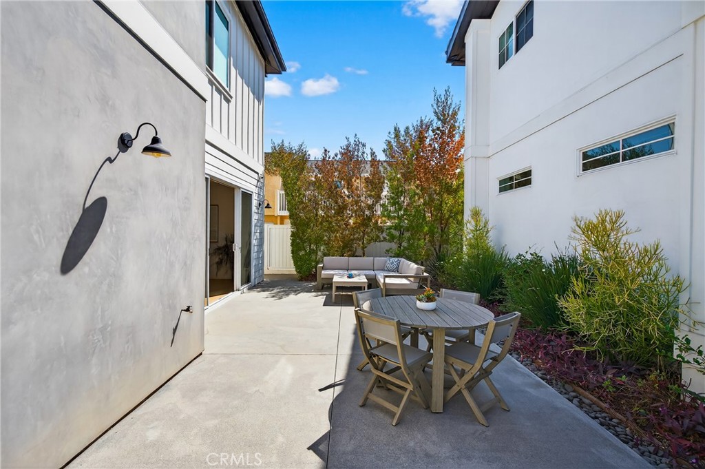2216 Bataan Road, Unit A Redondo Beach, CA 90278 - Photo 23 of 60 a patio with table and chairs and potted plants