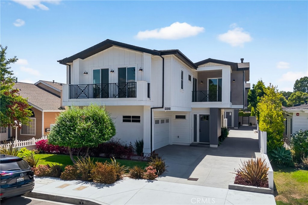 2216 Bataan Road, Unit A Redondo Beach, CA 90278 - Photo 3 of 60 a front view of a house with a yard and potted plants