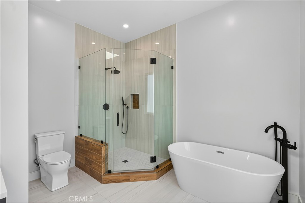 2216 Bataan Road, Unit A Redondo Beach, CA 90278 - Photo 37 of 60 a bathroom with a tub a toilet and a shower