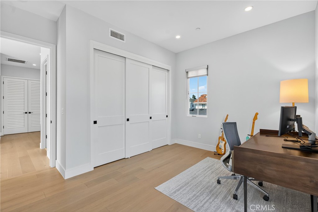 2216 Bataan Road, Unit A Redondo Beach, CA 90278 - Photo 45 of 60 a workspace with furniture and wooden floor