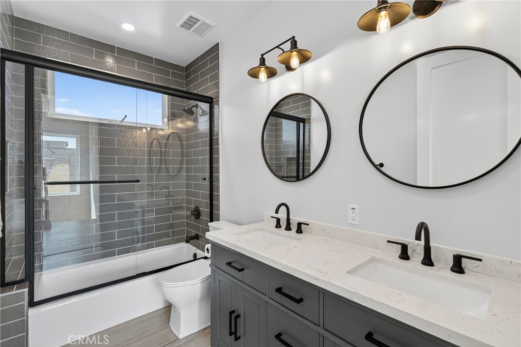 2216 Bataan Road, Unit A Redondo Beach, CA 90278 - Photo 46 of 60 a bathroom with a sink and a mirror
