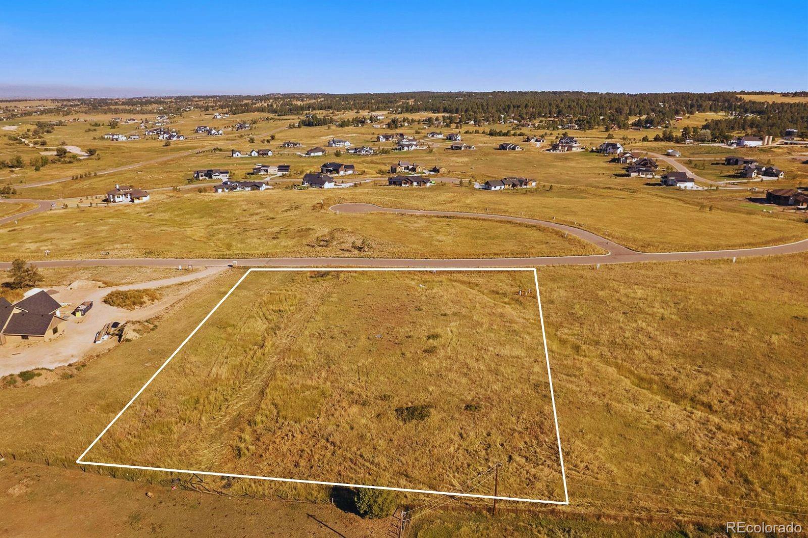 75 Evening Hunt Road Franktown, CO 80116 - Photo 4 of 7 a view of an ocean and beach
