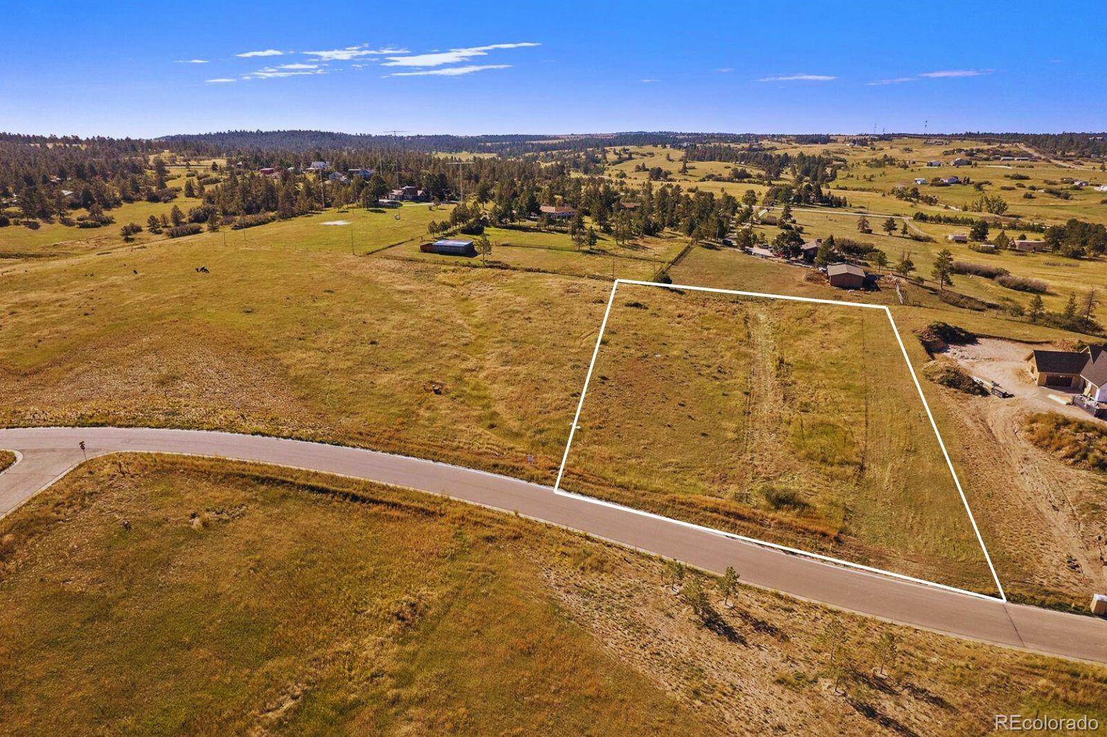 75 Evening Hunt Road Franktown, CO 80116 - Photo 7 of 7 a view of an ocean and beach