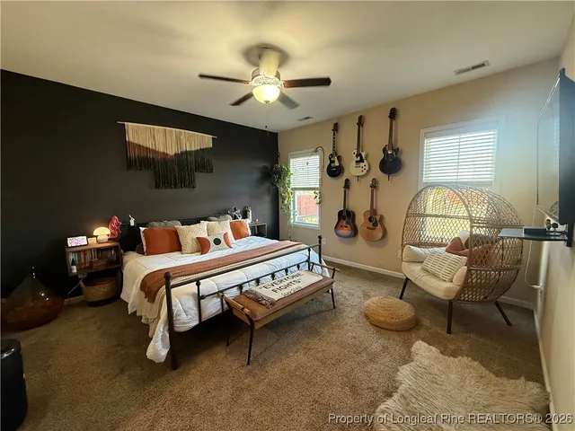 a bathroom with a sink mirror and vanity