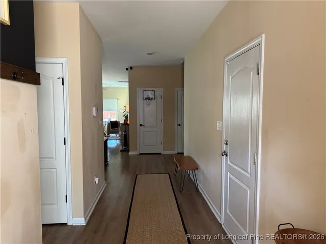 a view of a bathroom from a hallway