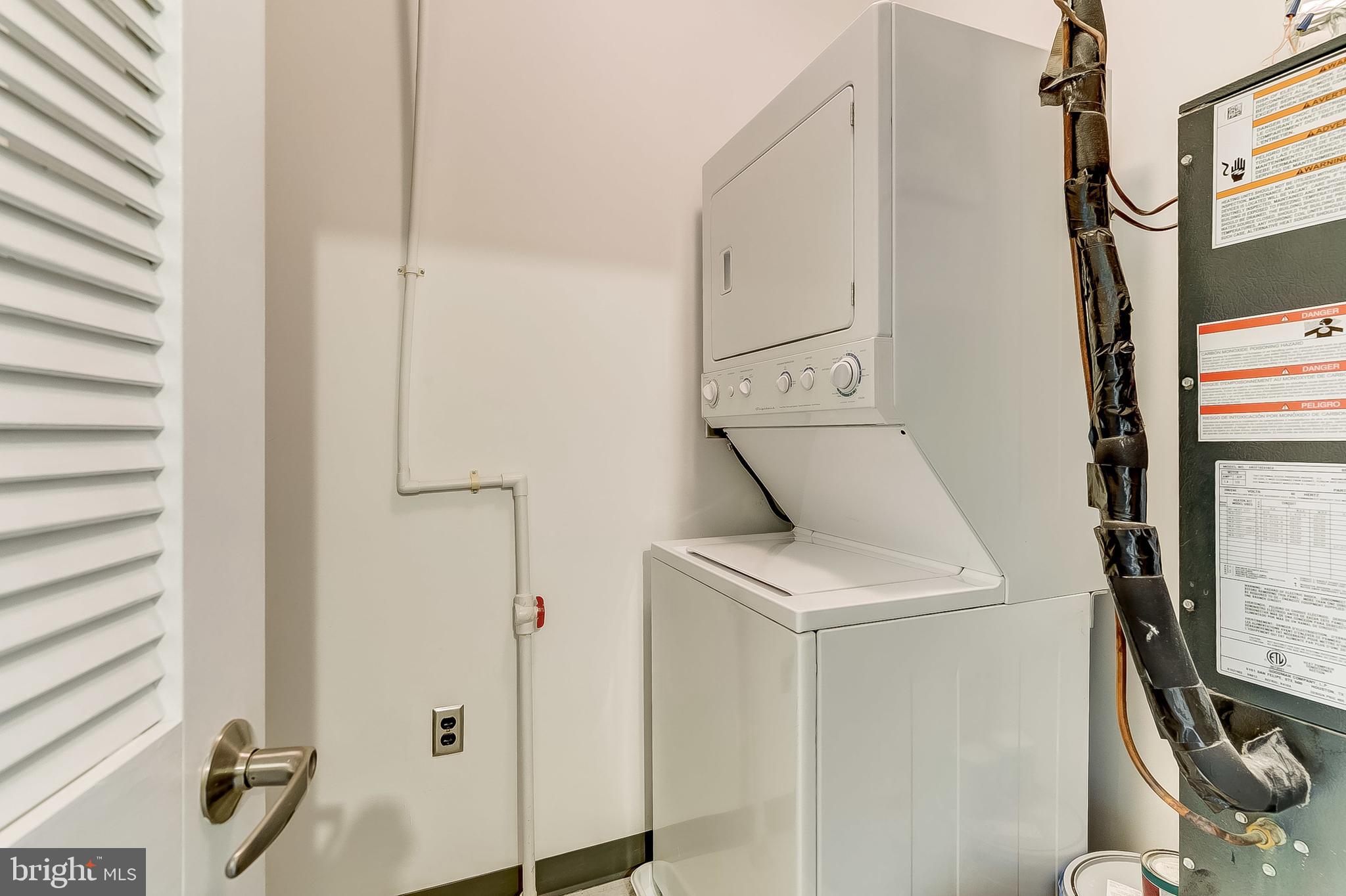 2007 Clipper Park Road, Unit 425 Baltimore, MD 21211 - Photo 28 of 51 Utility Room with Stack Washer/Dryer