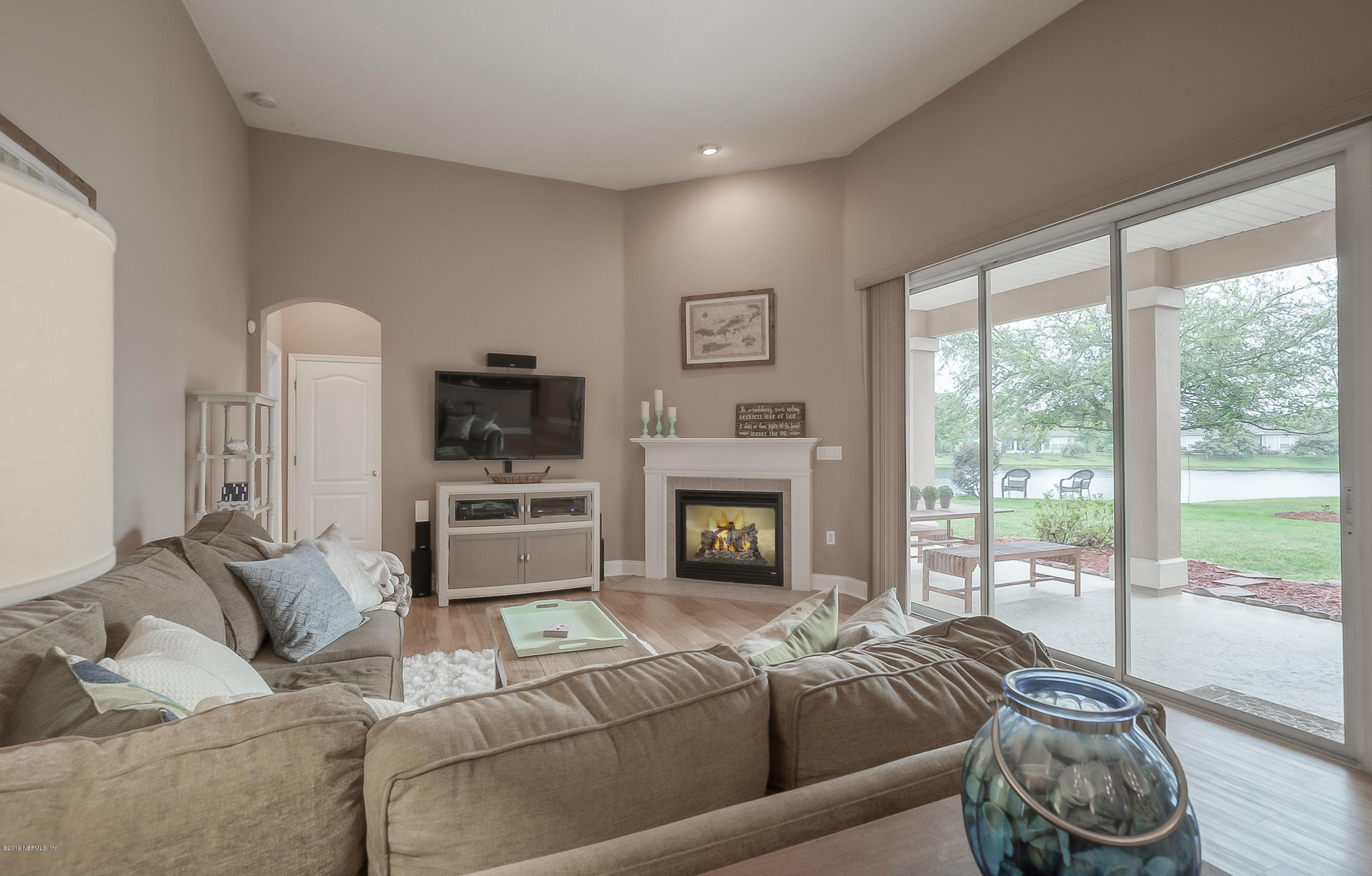 1327 Powis Road St. Augustine, FL 32095 - Photo 10 of 56 a living room with furniture and a fireplace