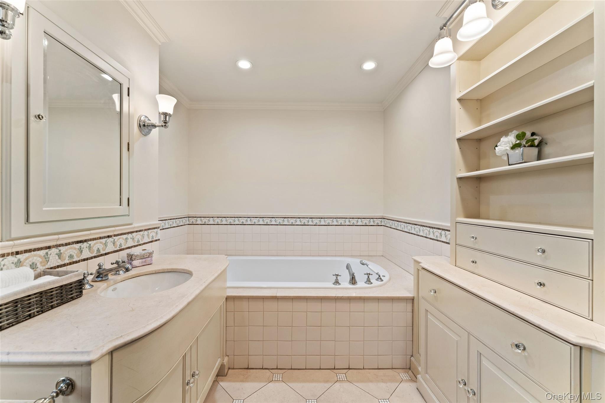 24 Olmsted Road Scarsdale, NY 10583 - Photo 18 of 39 a bathroom with a bathtub and a sink