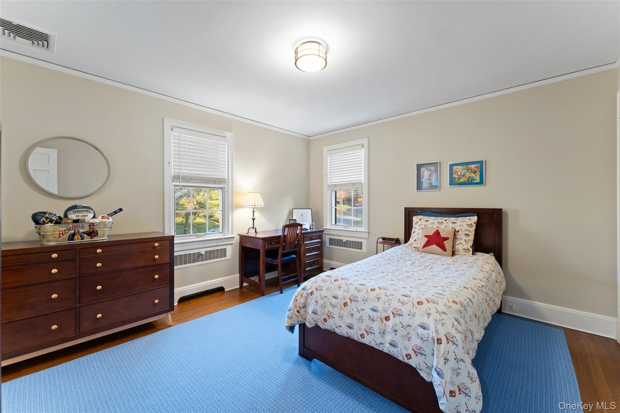 24 Olmsted Road Scarsdale, NY 10583 - Photo 20 of 39 a bedroom with a bed and a dresser