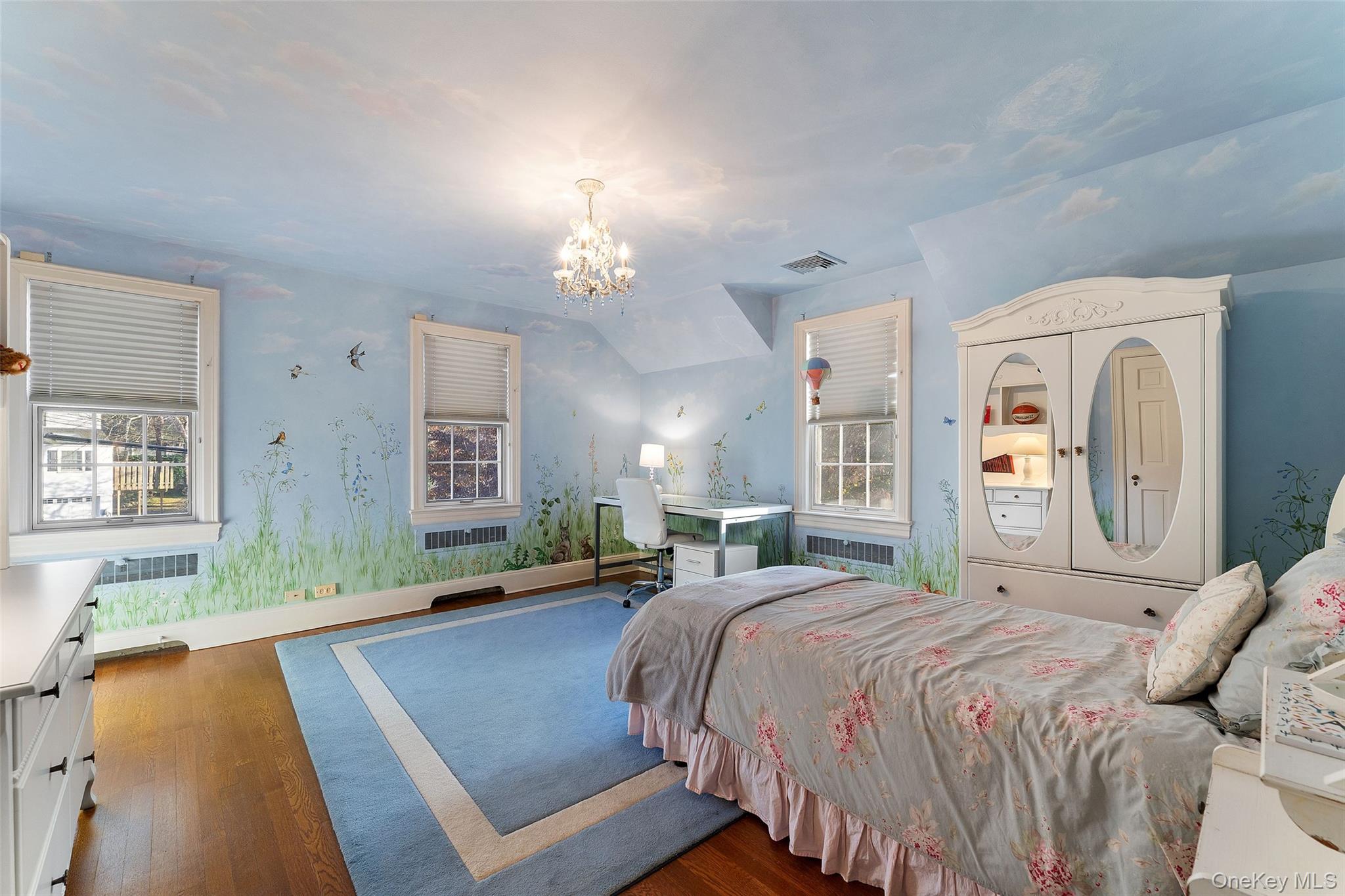 24 Olmsted Road Scarsdale, NY 10583 - Photo 22 of 39 a bedroom with a bed mirror and window