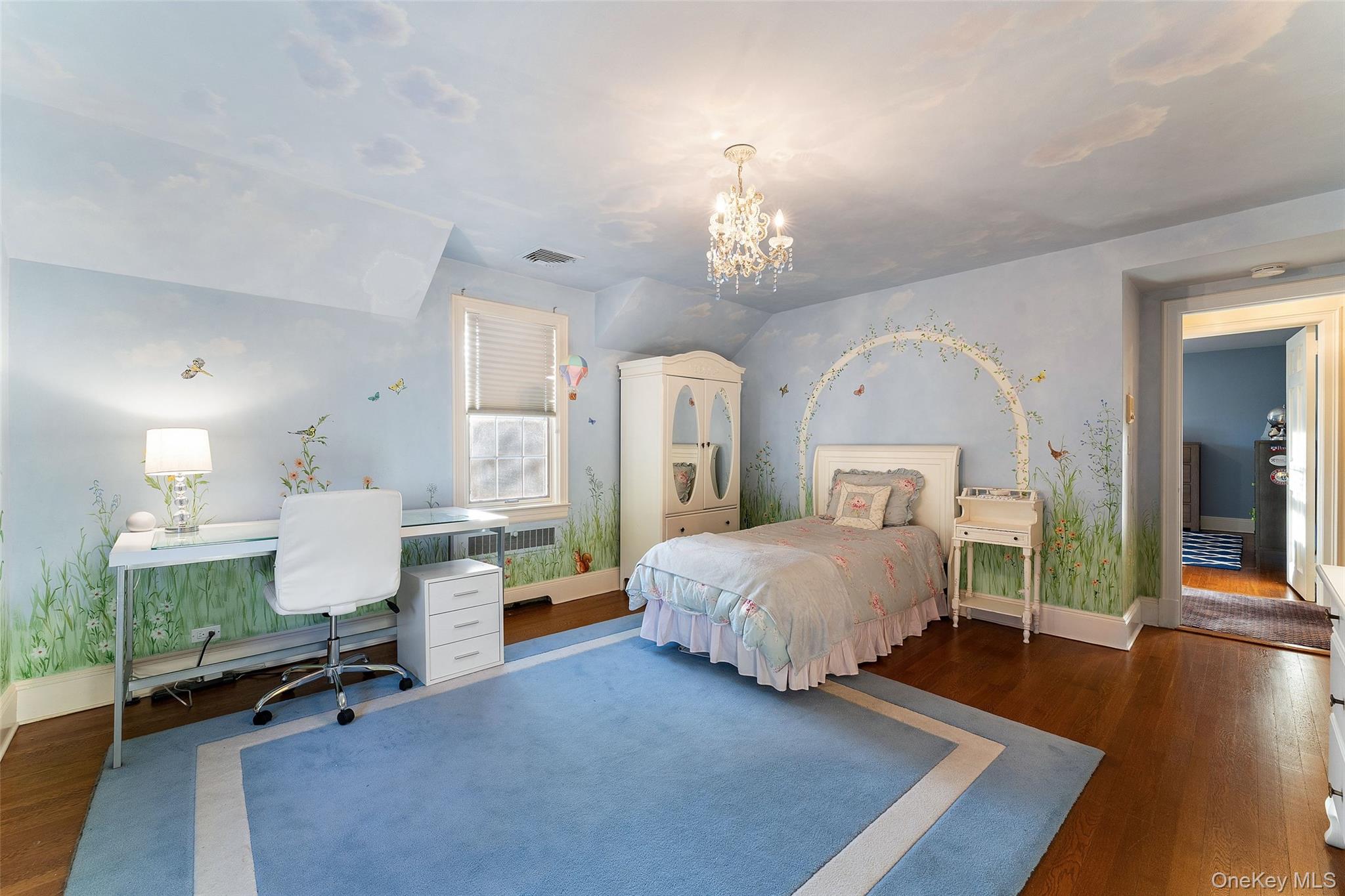 24 Olmsted Road Scarsdale, NY 10583 - Photo 23 of 39 a spacious bedroom with a bed window and table chair