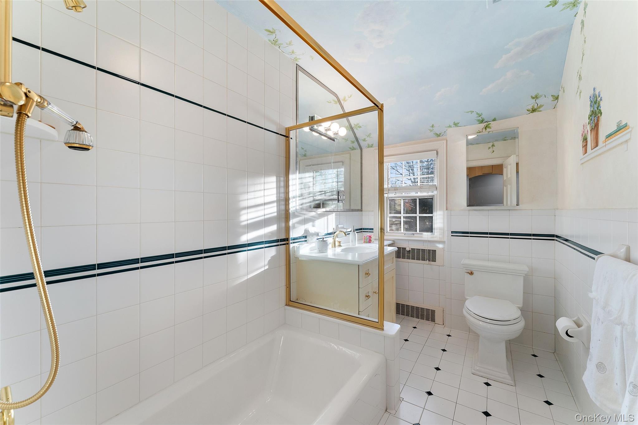 24 Olmsted Road Scarsdale, NY 10583 - Photo 24 of 39 a bathroom with a toilet a sink and a shower