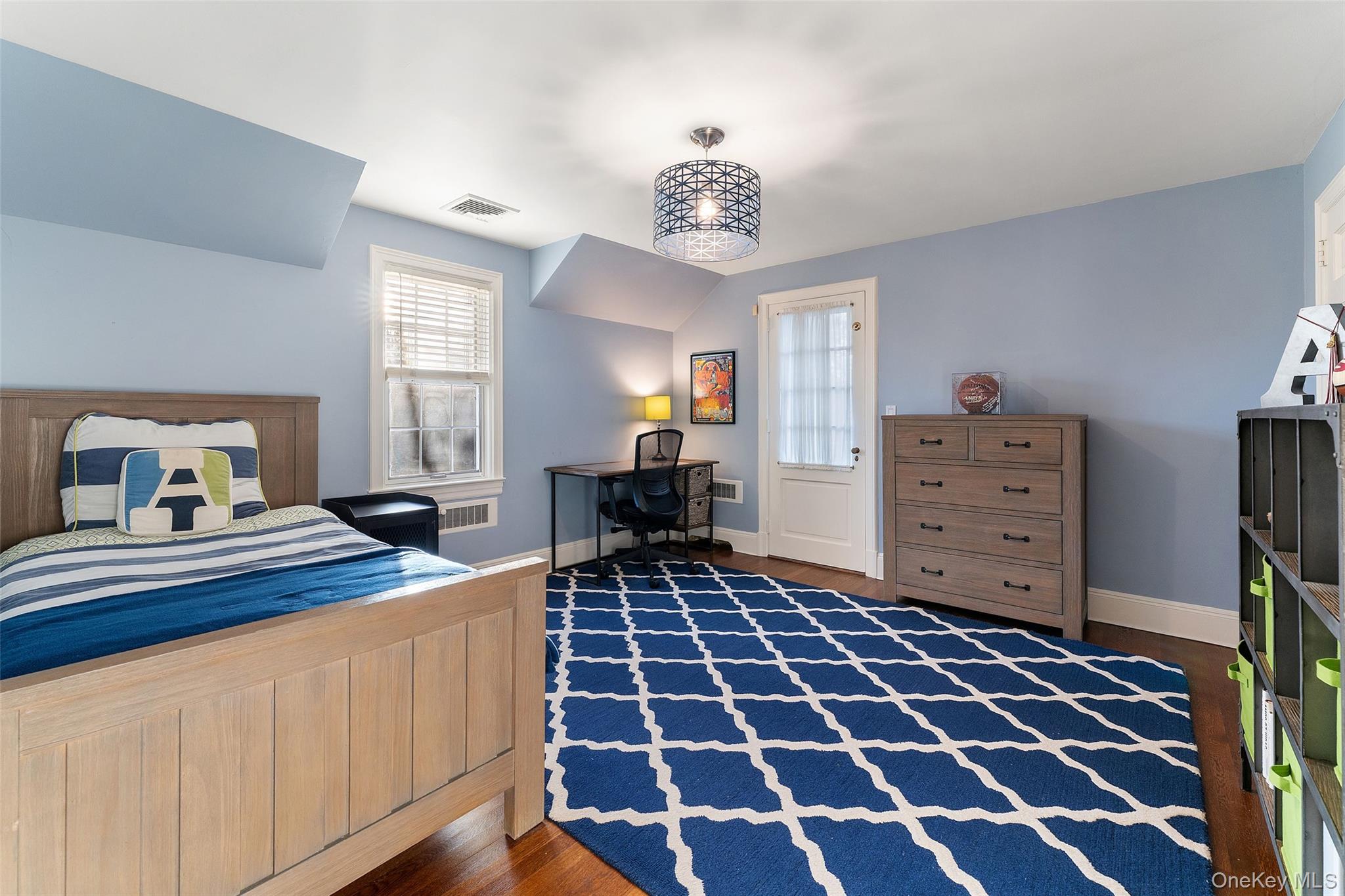 24 Olmsted Road Scarsdale, NY 10583 - Photo 25 of 39 a bedroom with a bed and a dresser