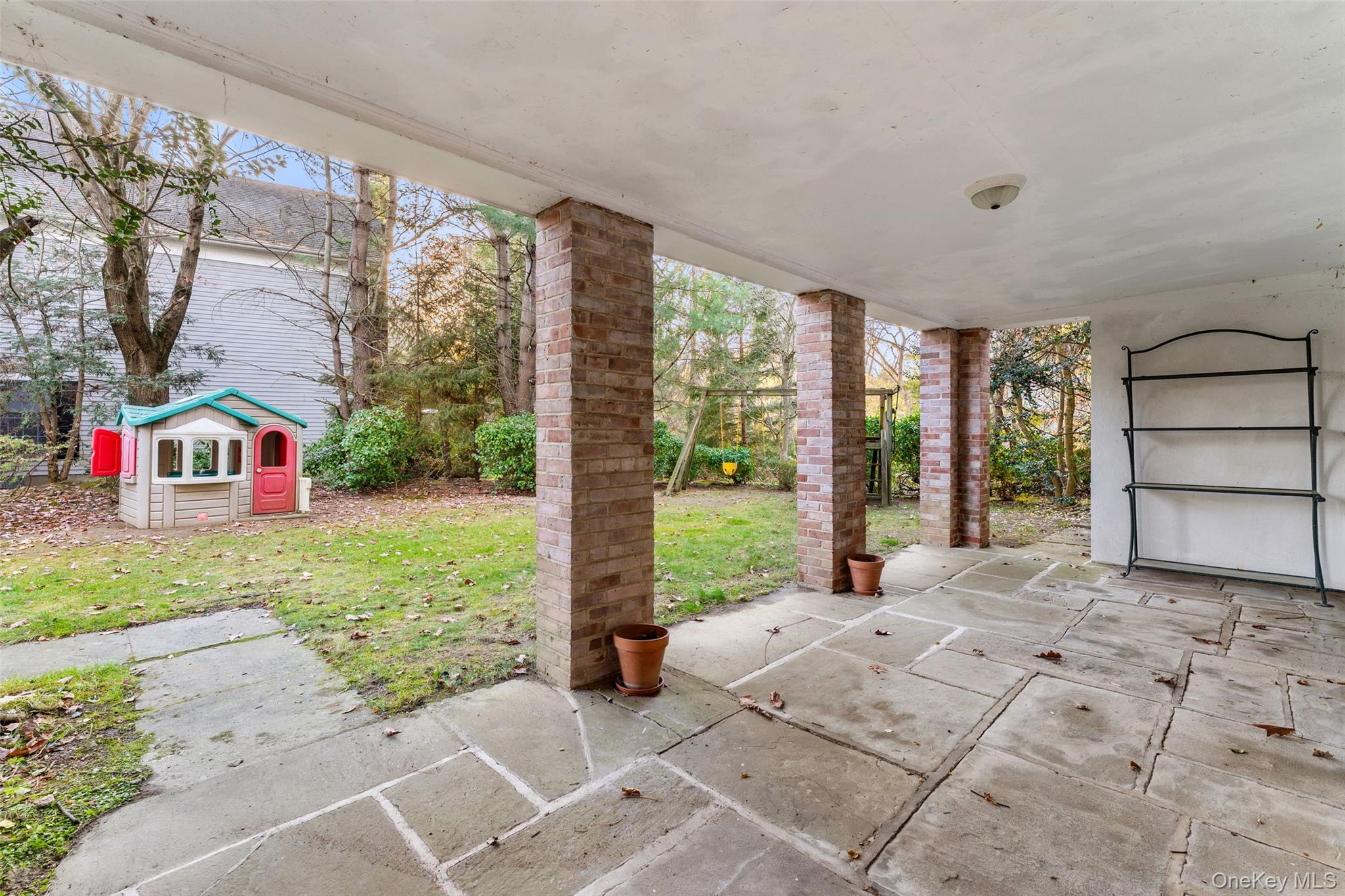 24 Olmsted Road Scarsdale, NY 10583 - Photo 32 of 39 a bedroom with furniture and a large window