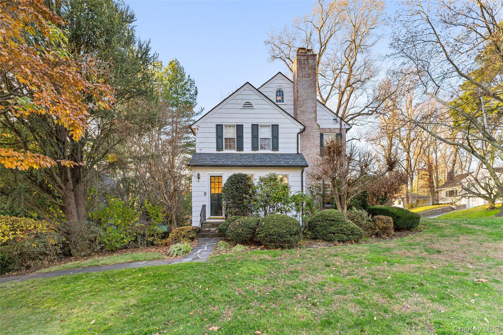24 Olmsted Road Scarsdale, NY 10583 - Photo 35 of 39 a front view of a house with garden