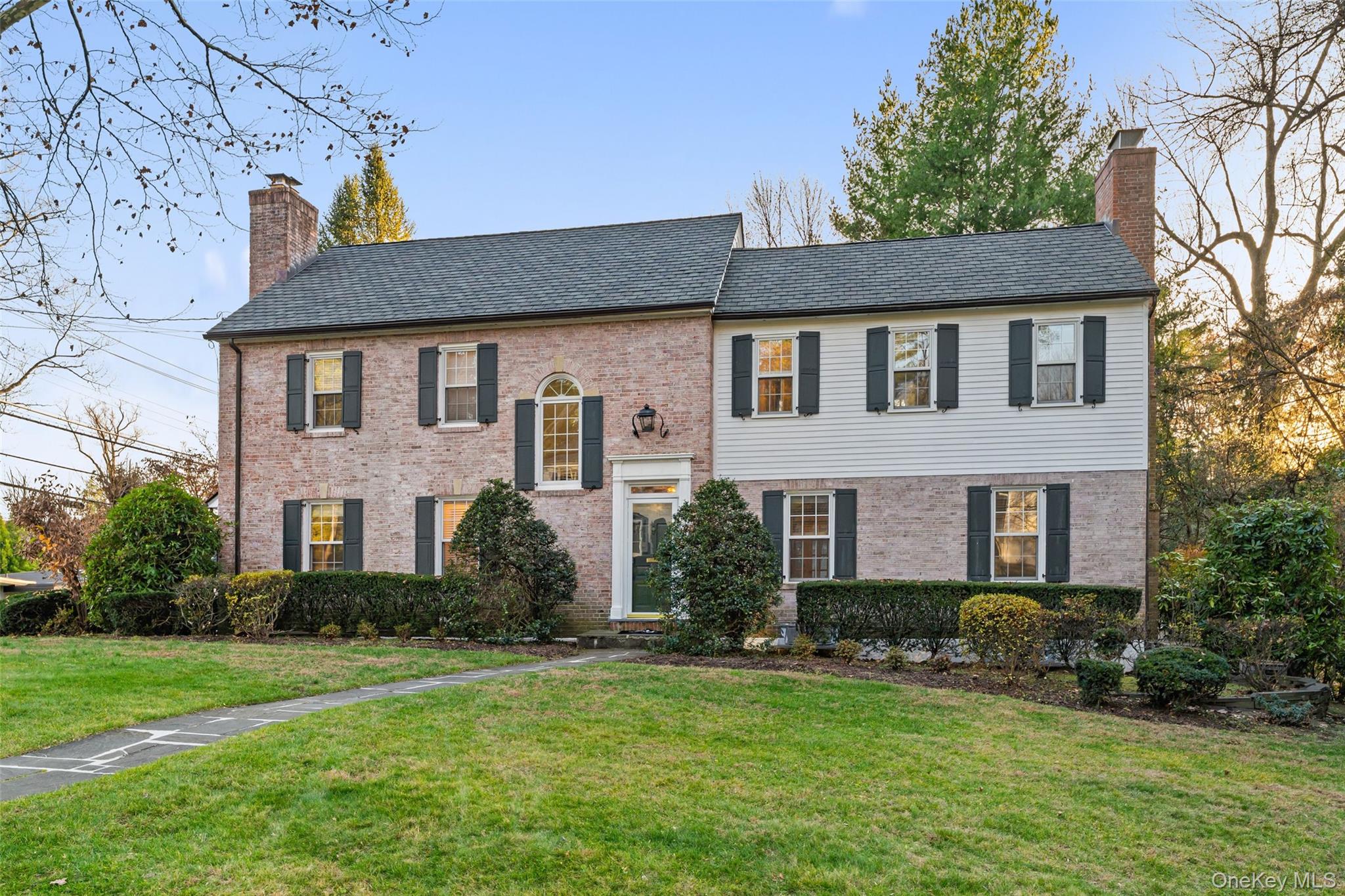 24 Olmsted Road Scarsdale, NY 10583 - Photo 39 of 39 a front view of a house with a yard