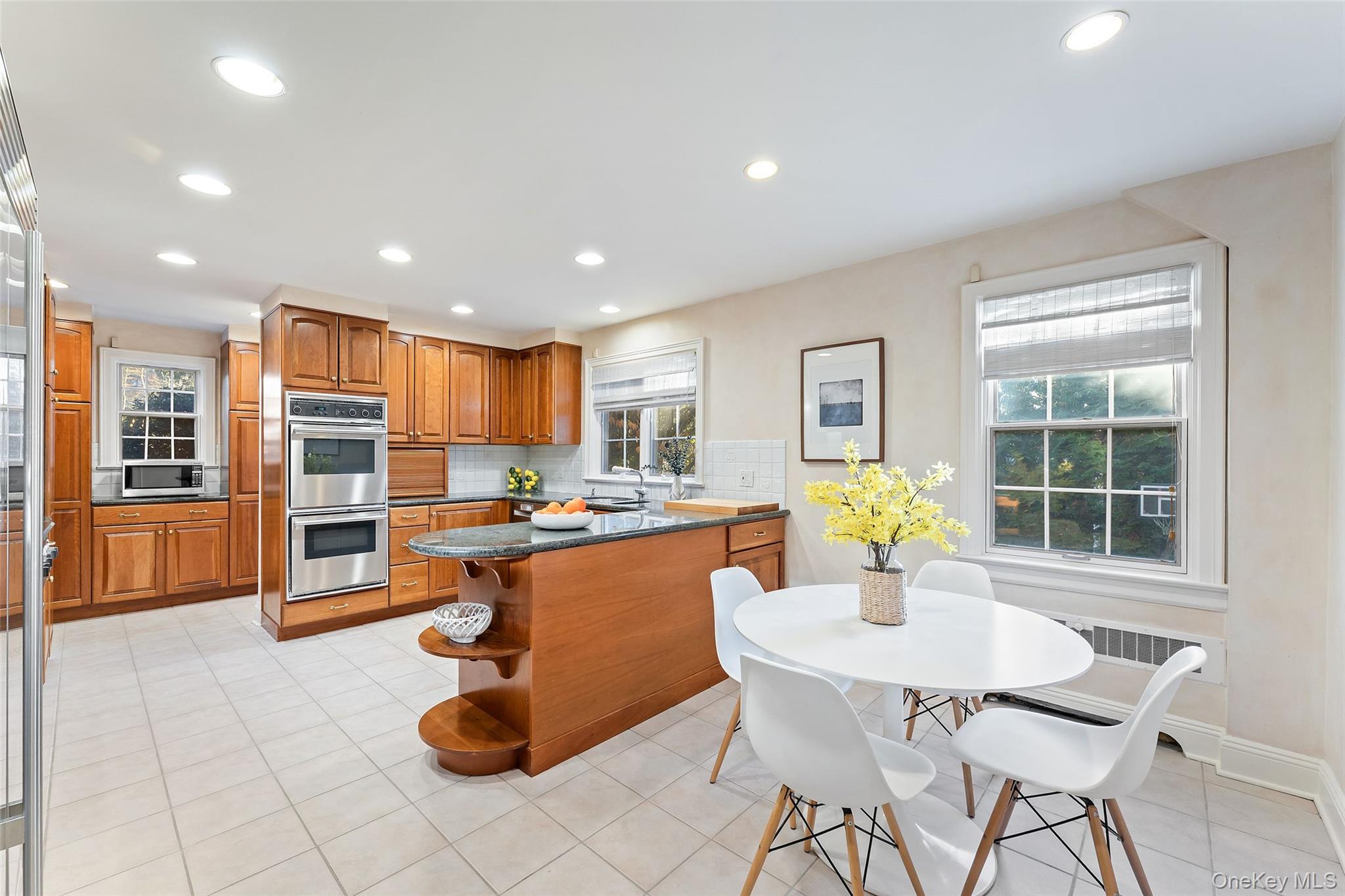 24 Olmsted Road Scarsdale, NY 10583 - Photo 9 of 39 a view of a dining room with furniture and chandelier