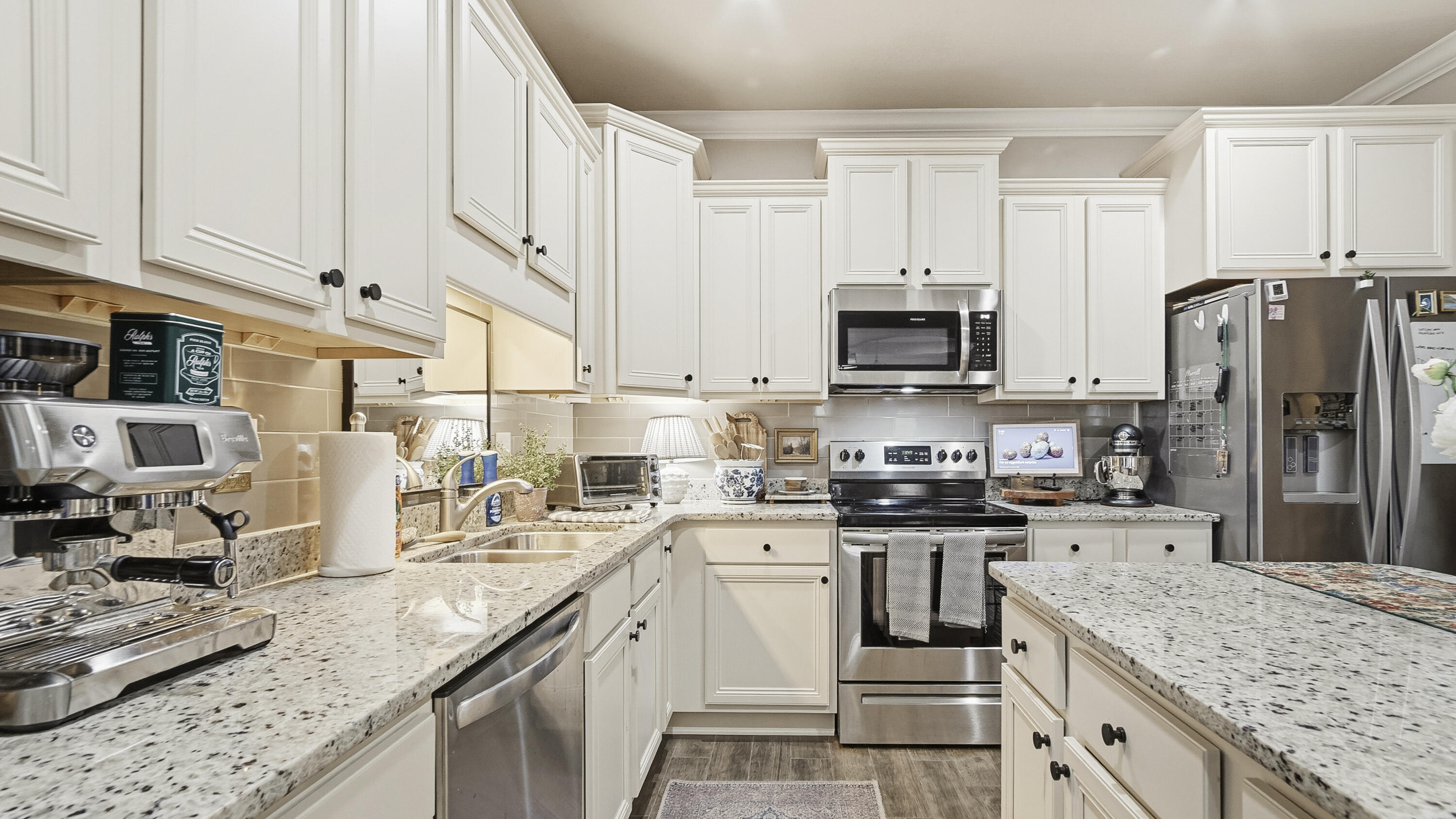 54 Lottie Loop Freeport, FL 32439 - Photo 15 of 63 a kitchen with stainless steel appliances granite countertop a sink stove refrigerator and cabinets