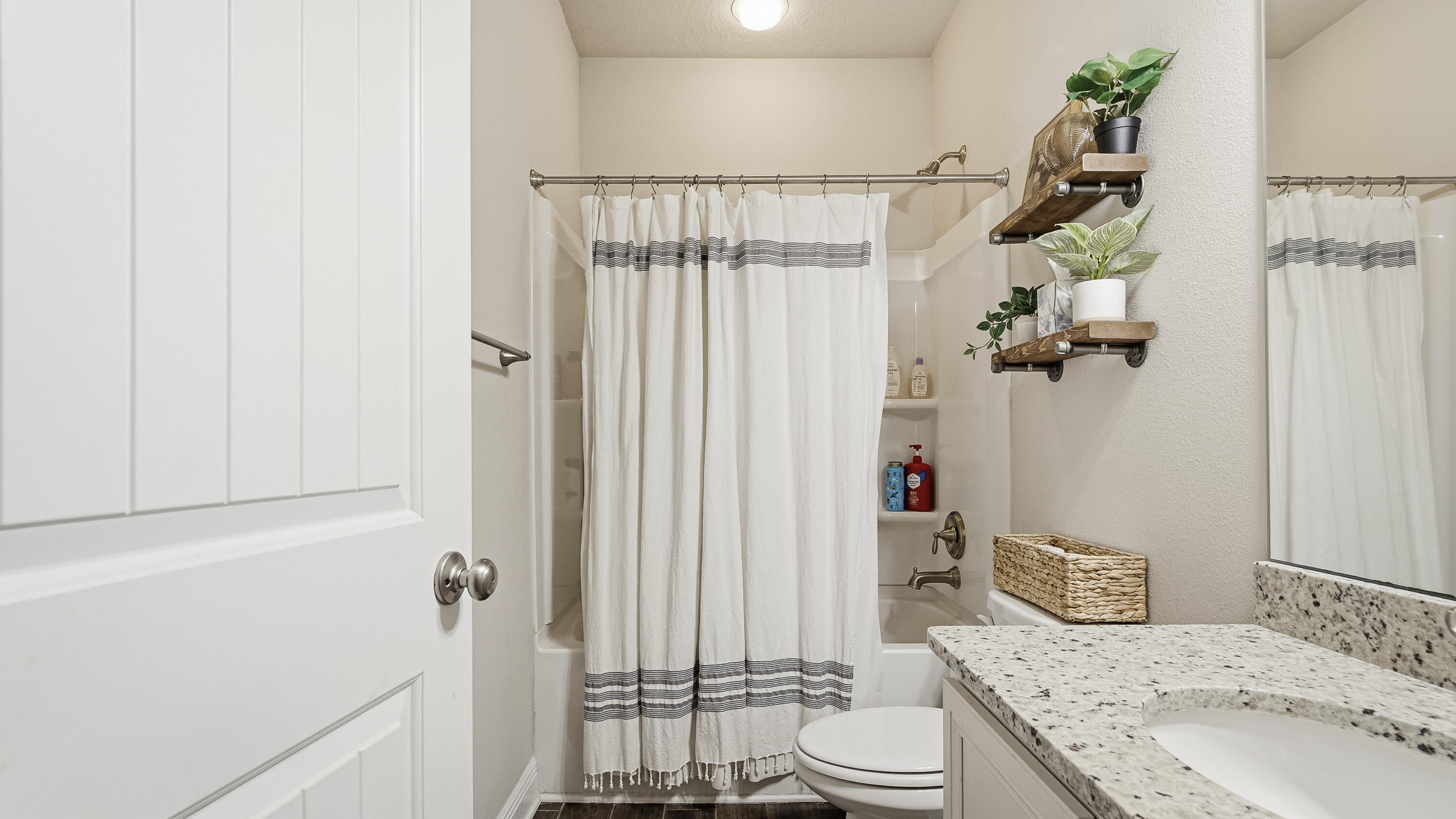 54 Lottie Loop Freeport, FL 32439 - Photo 26 of 63 a bathroom with a sink a toilet and shower curtain