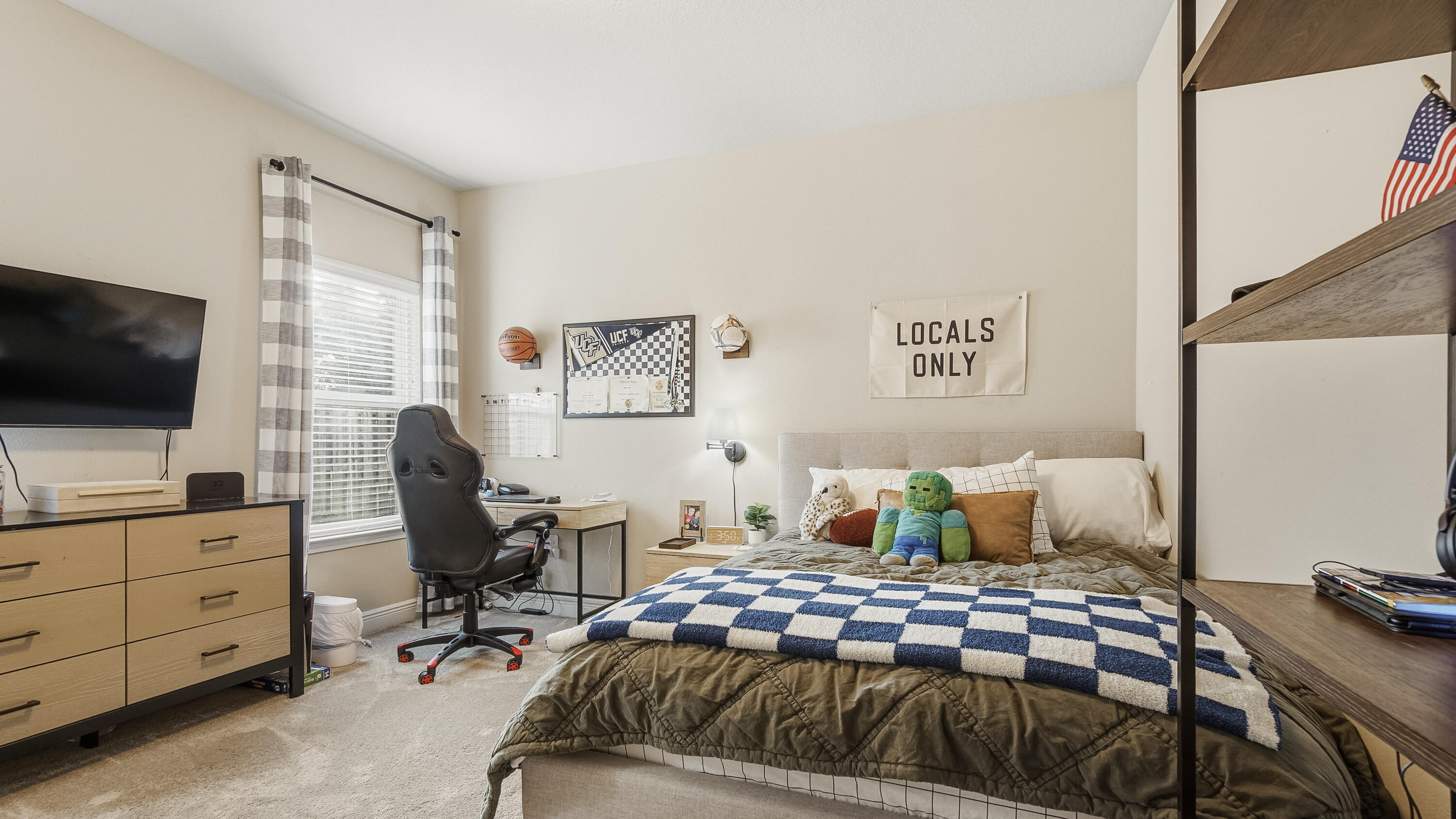 54 Lottie Loop Freeport, FL 32439 - Photo 28 of 63 a bedroom with a bed and flat screen tv