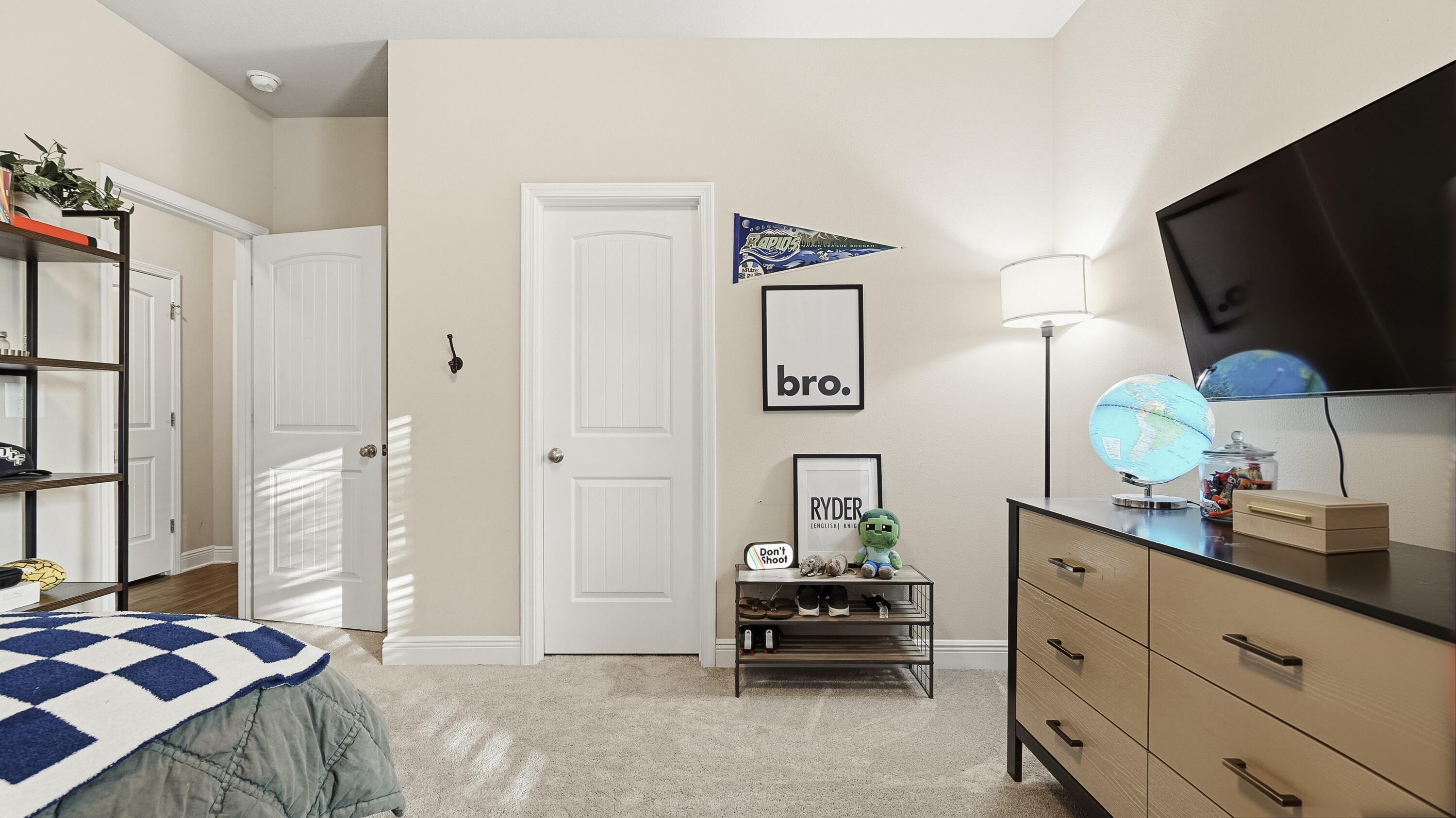 54 Lottie Loop Freeport, FL 32439 - Photo 29 of 63 a bedroom with furniture and a flat screen tv