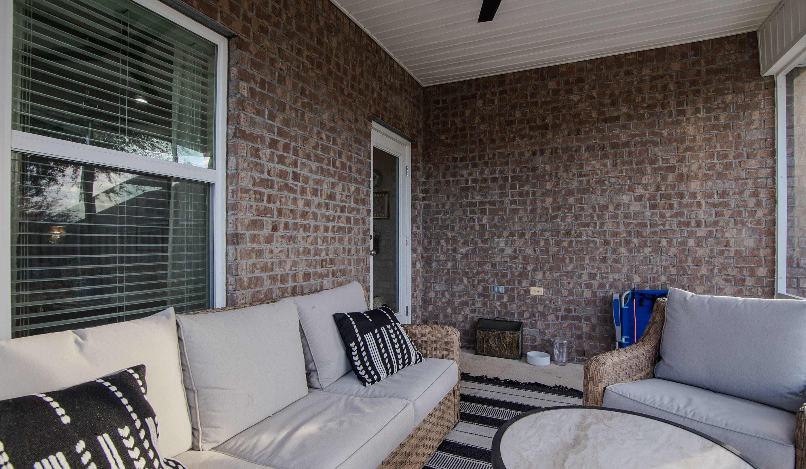 54 Lottie Loop Freeport, FL 32439 - Photo 38 of 63 a view of a patio with couches table and chairs and potted plants