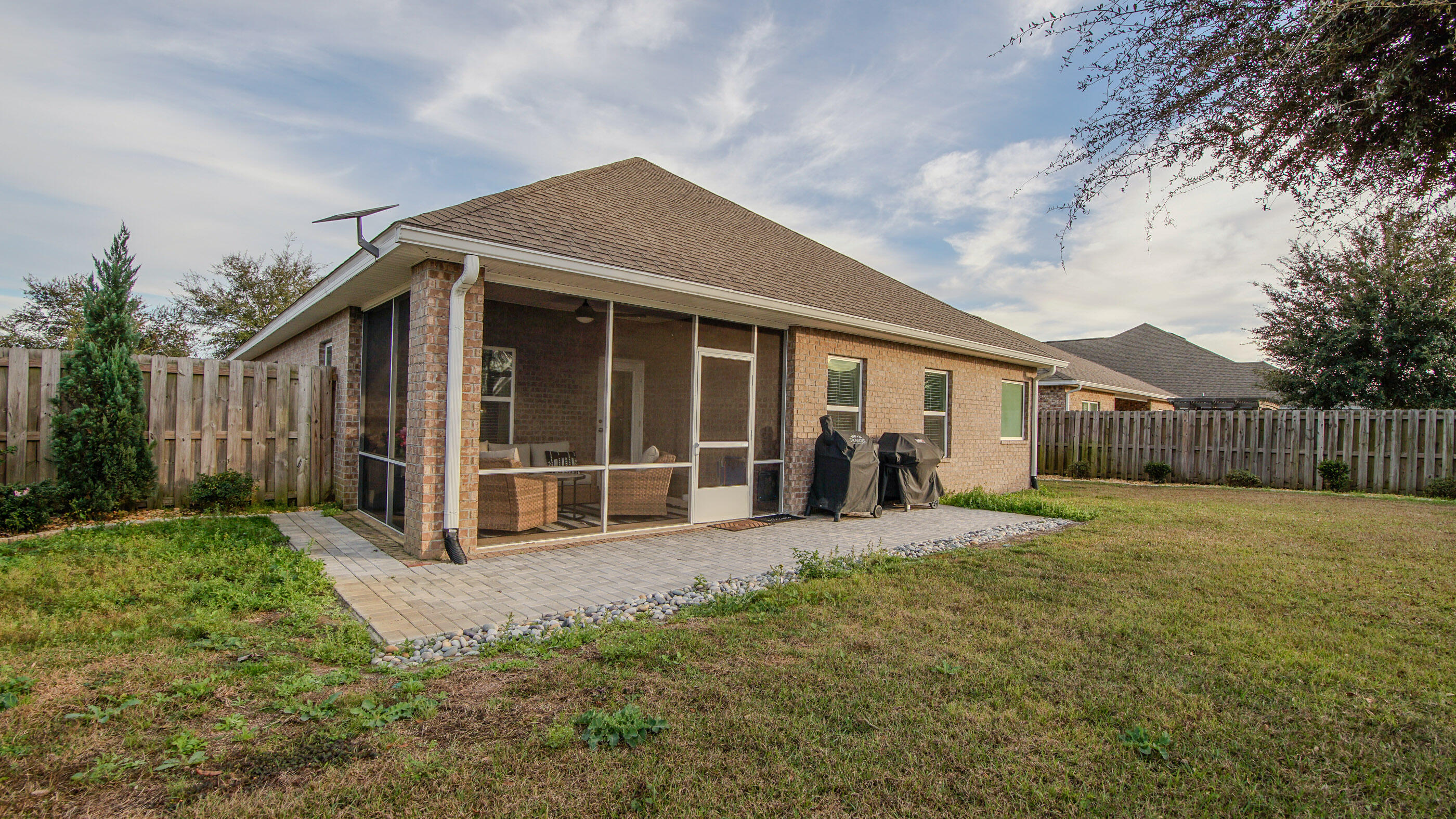 54 Lottie Loop Freeport, FL 32439 - Photo 39 of 63 a front view of a house with a yard outdoor seating and garage