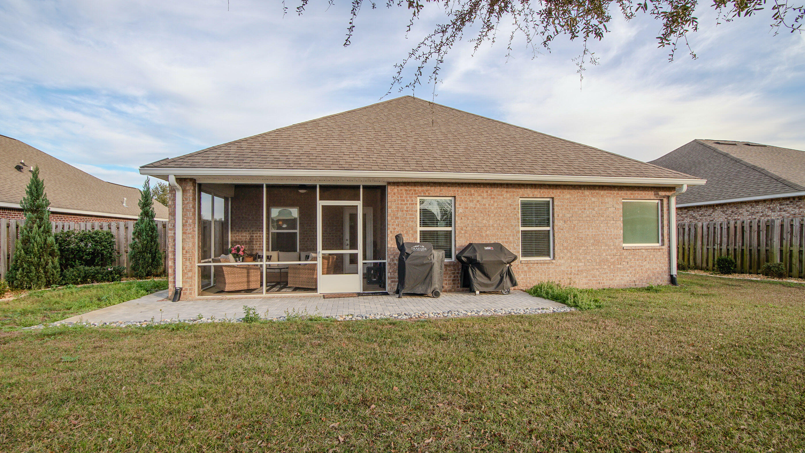 54 Lottie Loop Freeport, FL 32439 - Photo 41 of 63 a front view of house with yard and seating area
