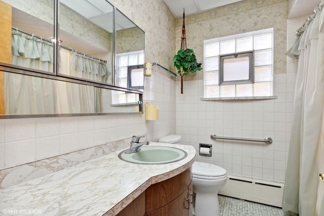 a bathroom with a sink and a toilet