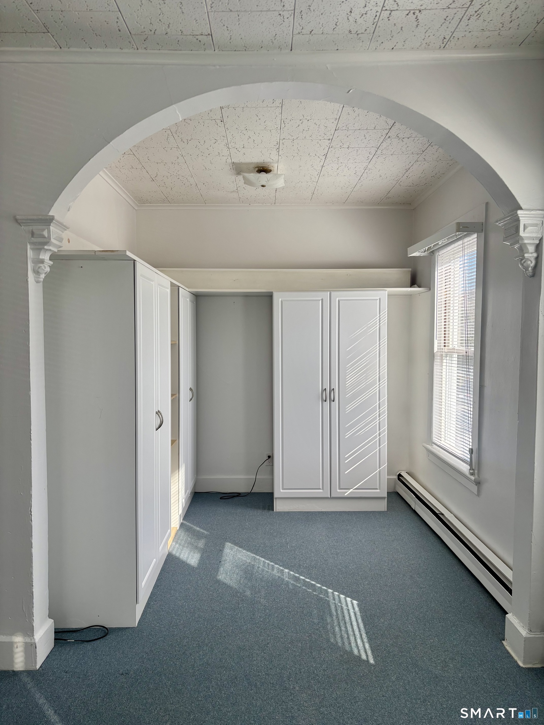 73 Peck Street, Unit 2 Norwich, CT 06360 - Photo 10 of 10 an empty room with windows