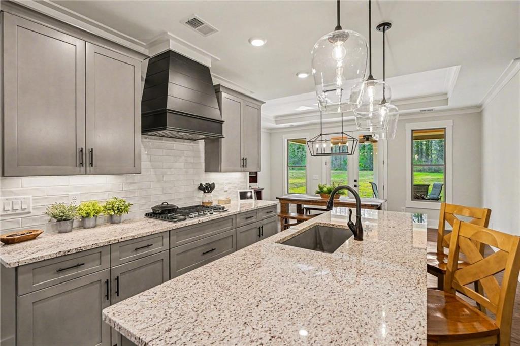287 Conner Lane Williamson, GA 30292 - Photo 8 of 33 a kitchen with stainless steel appliances a sink a counter top space cabinets and a window