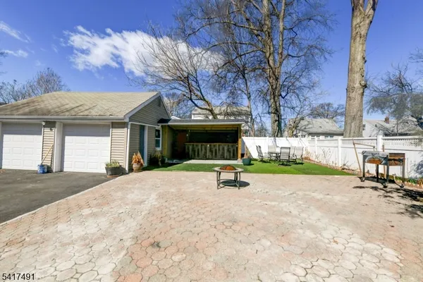 a view of a house with a snow in the yard