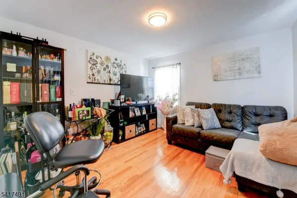 a bedroom with furniture and a mirror