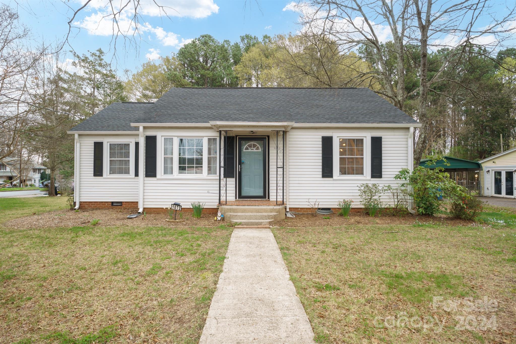 a front view of a house with a yard
