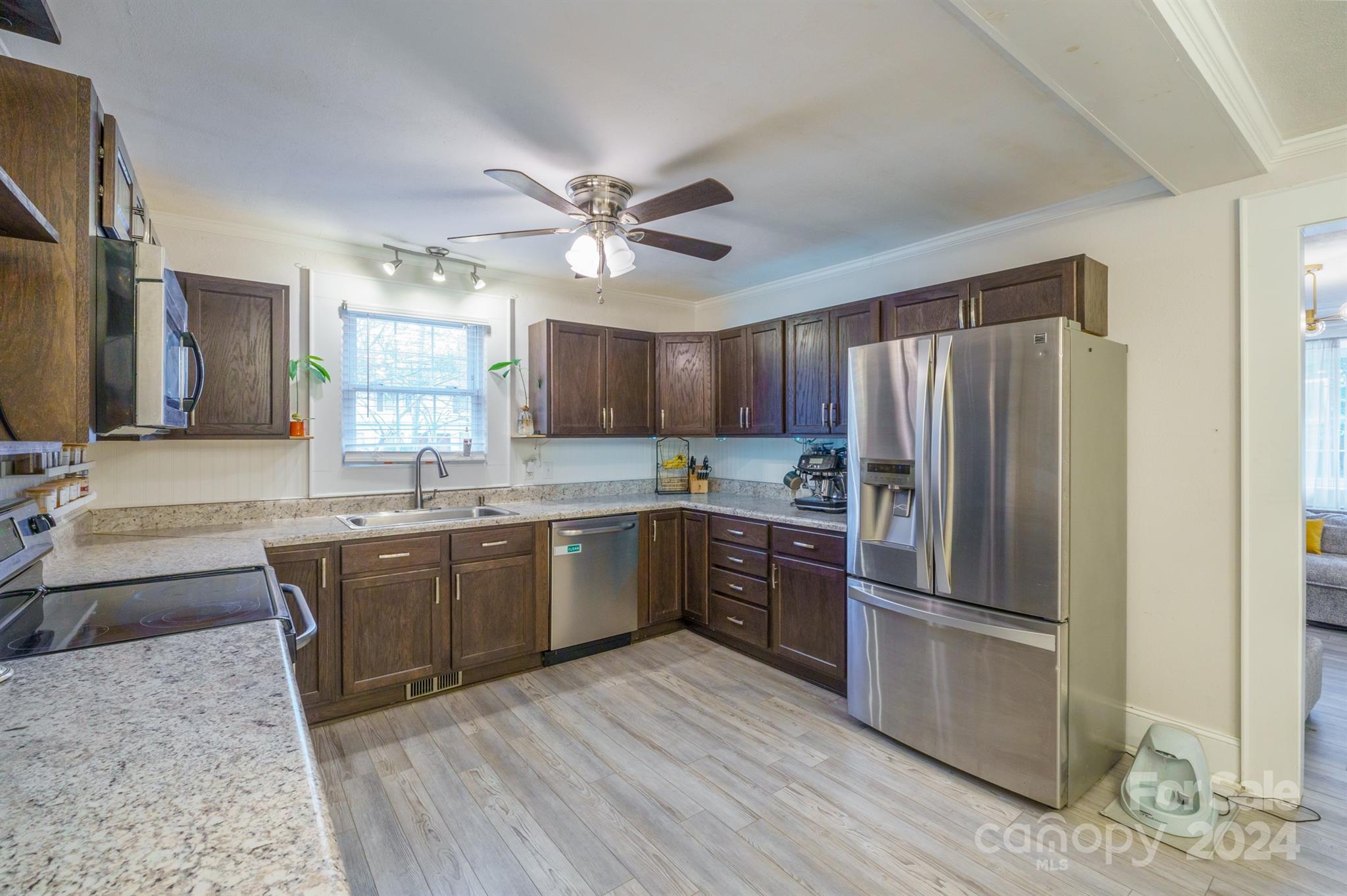 1072 5th Street Northeast Hickory, NC 28601 - Photo 11 of 27 a kitchen with stainless steel appliances granite countertop a refrigerator stove and sink