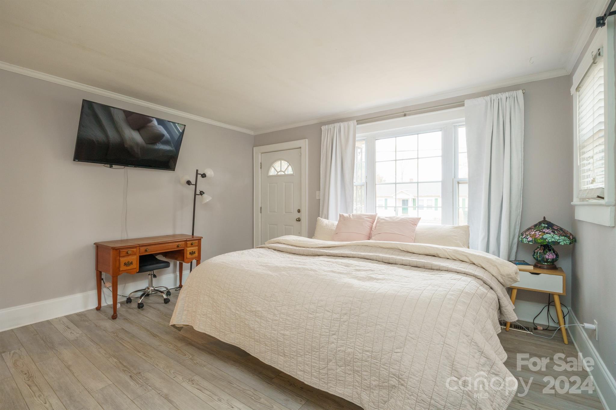 1072 5th Street Northeast Hickory, NC 28601 - Photo 16 of 27 a bedroom with a bed and a flat screen tv