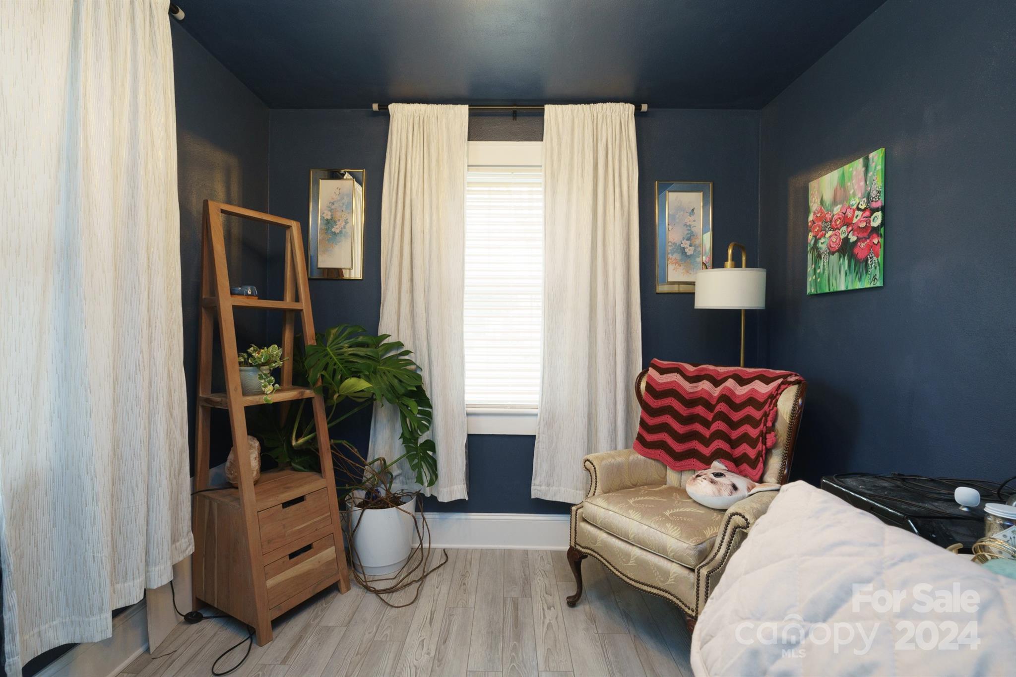 1072 5th Street Northeast Hickory, NC 28601 - Photo 18 of 27 a bedroom with furniture and a potted plant