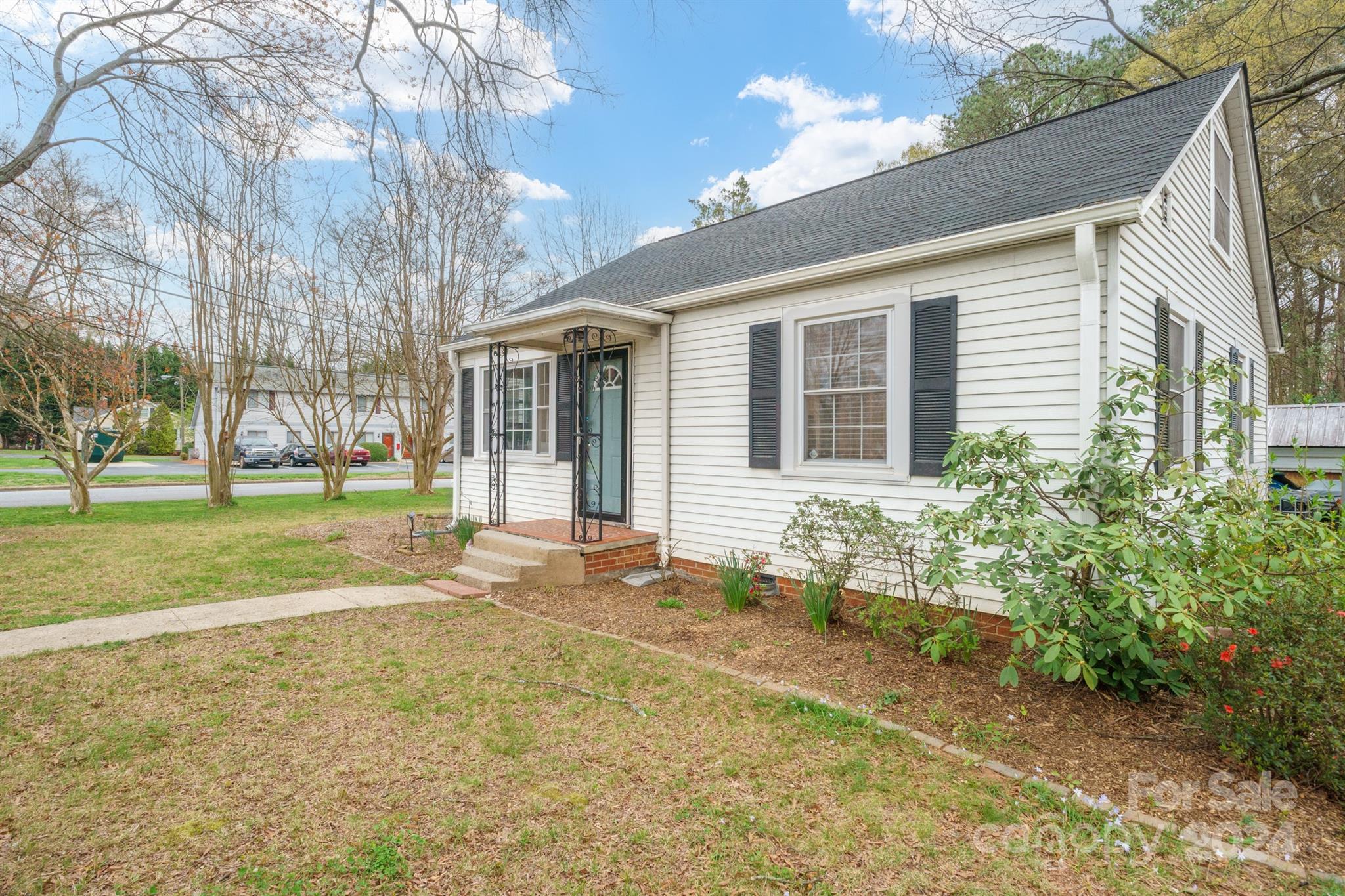 1072 5th Street Northeast Hickory, NC 28601 - Photo 2 of 27 a house with trees in front of it