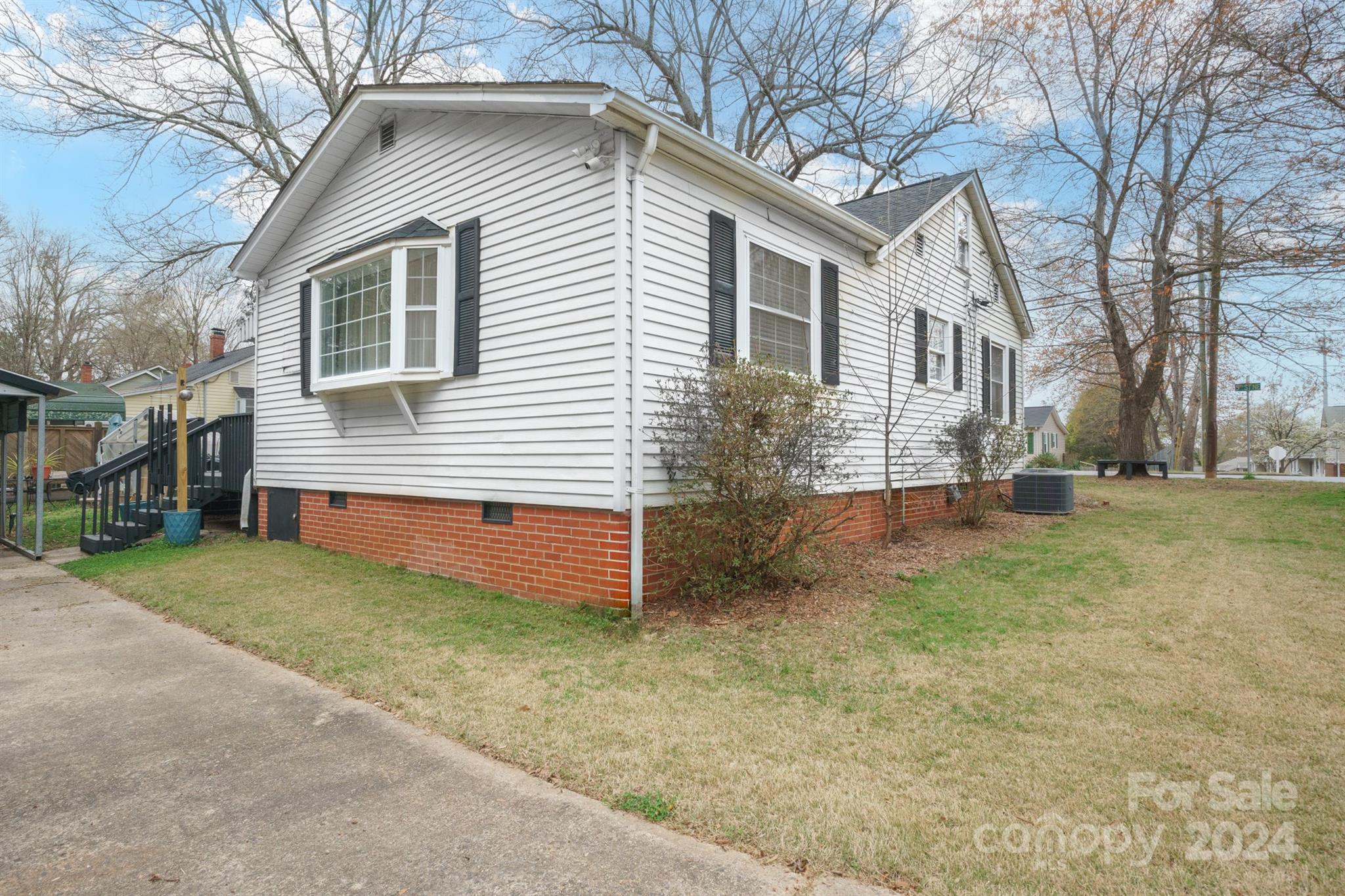1072 5th Street Northeast Hickory, NC 28601 - Photo 3 of 27 a view of a house with a yard