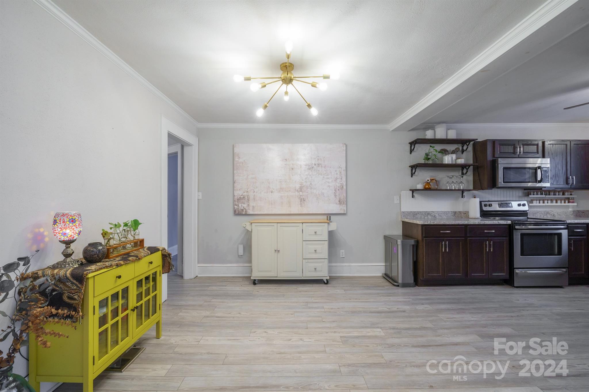 1072 5th Street Northeast Hickory, NC 28601 - Photo 8 of 27 a kitchen with a stove top oven cabinets and a window