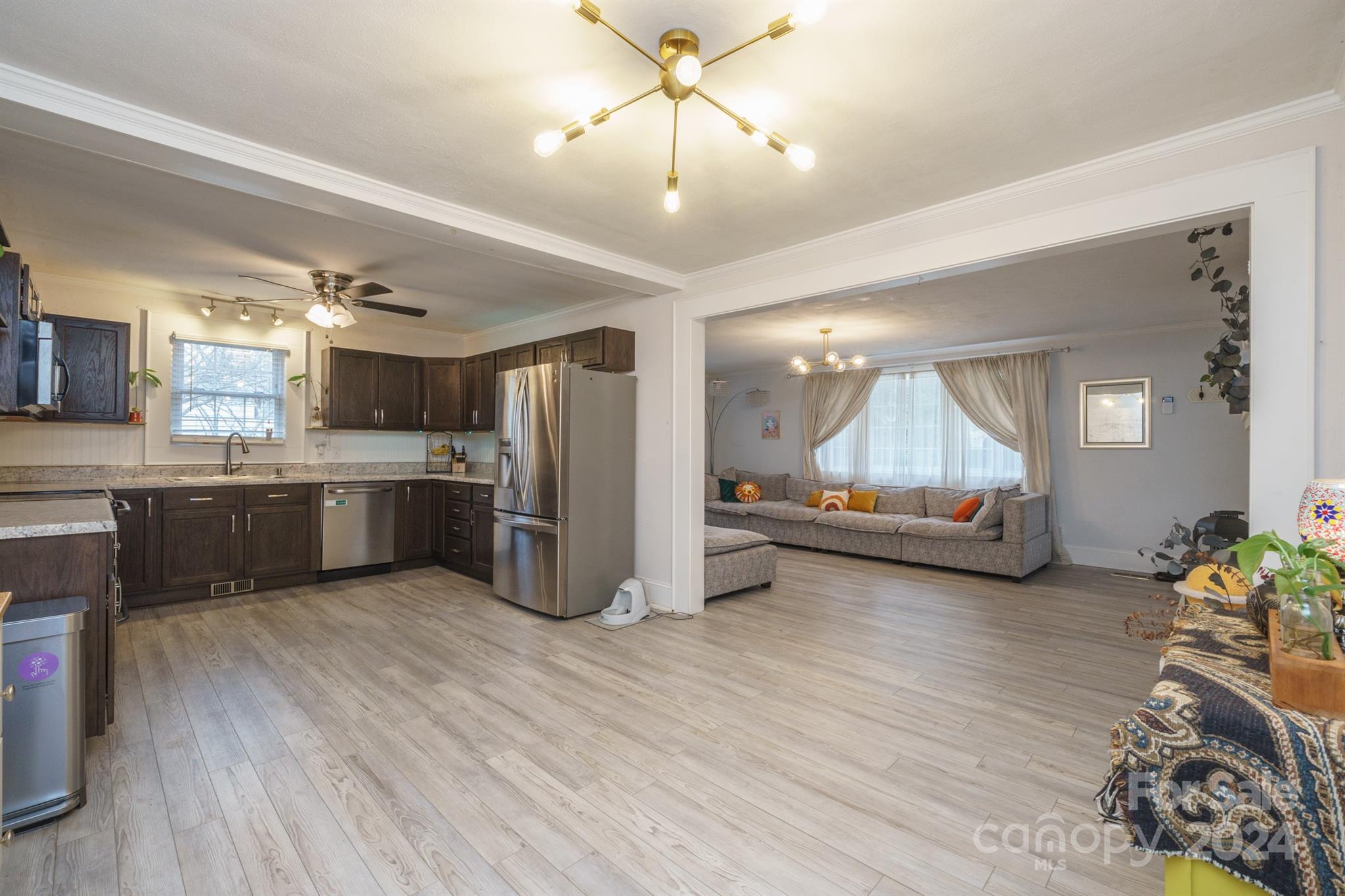 1072 5th Street Northeast Hickory, NC 28601 - Photo 9 of 27 a living room with furniture and a chandelier