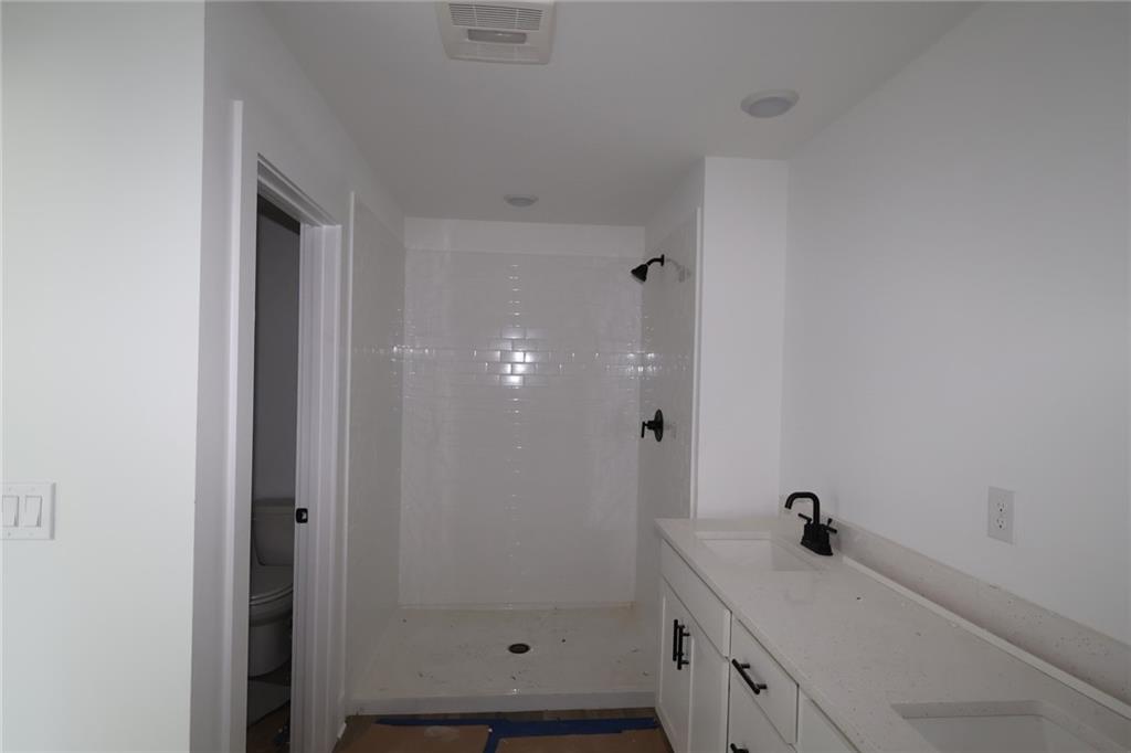 230 Redbud Road Canton, GA 30114 - Photo 9 of 11 a bathroom with a sink and a mirror