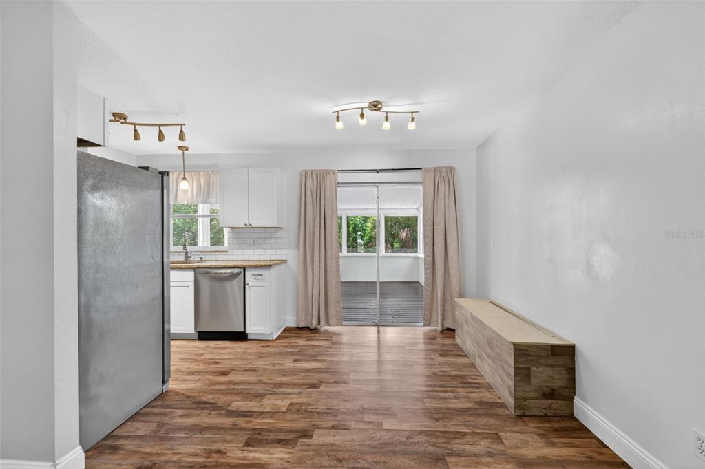 36 Bay Ridge Loop Mascotte, FL 34753 - Photo 10 of 32 a view of a kitchen with wooden floor and a kitchen