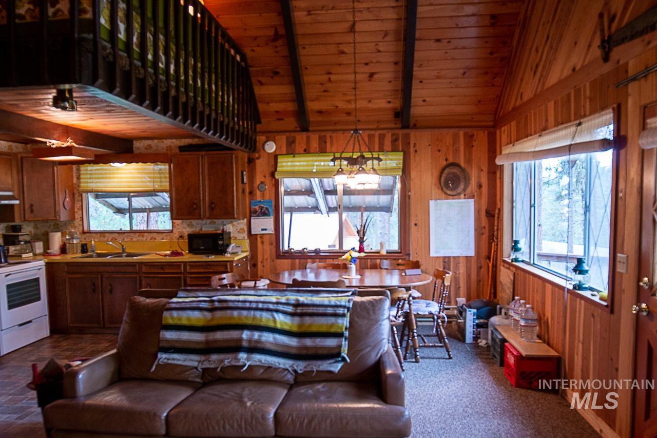 225 Mesplie Road Placerville, ID 83666 - Photo 18 of 39 Living room with wood walls and wooden ceiling