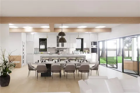 a large kitchen with a table and chairs